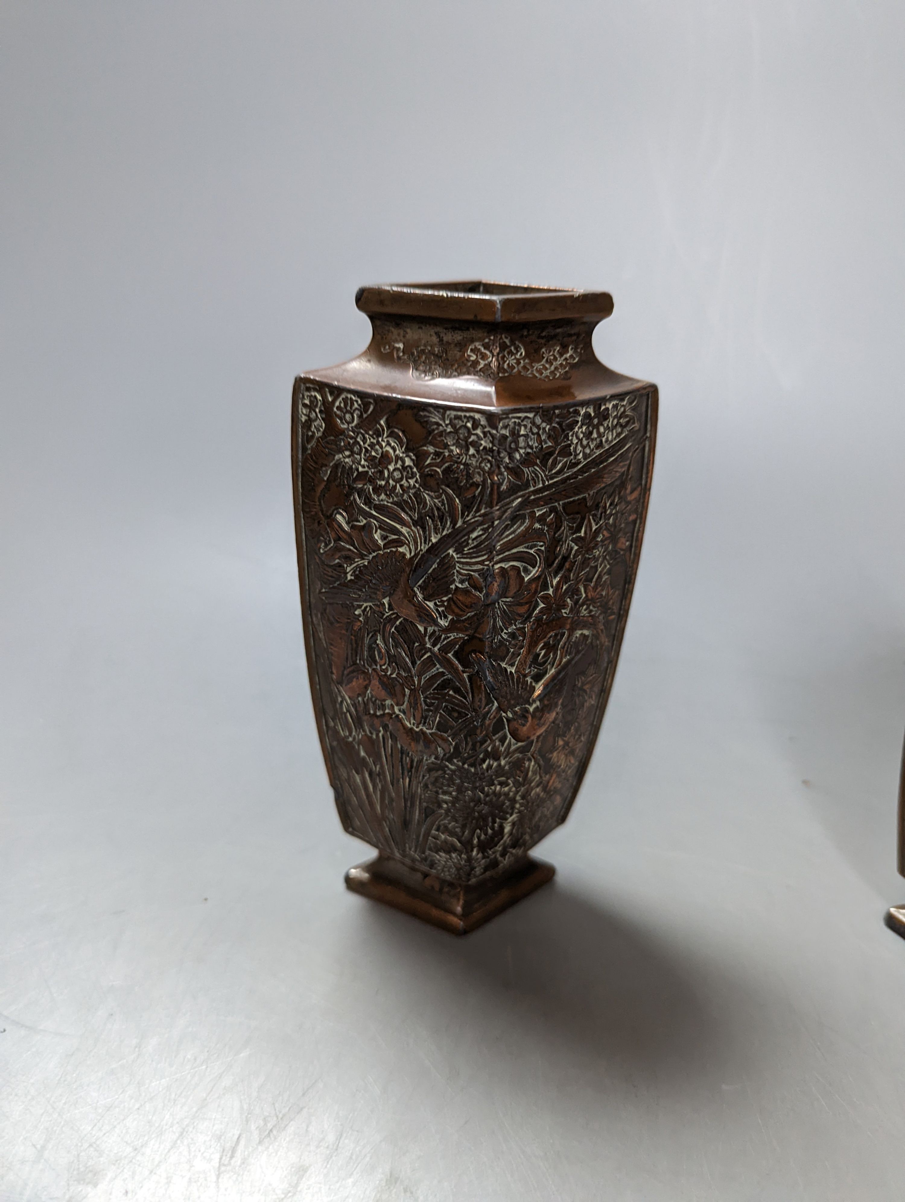 A Japanese bronzed antimony smoker's stand and a pair of vases, stand 19 cms wide.